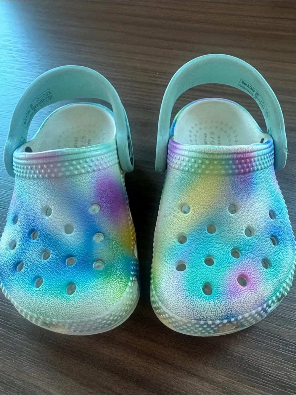 CROCS Kids Tie-Dye Foam Clogs in Blue, Purple, Yellow, Green